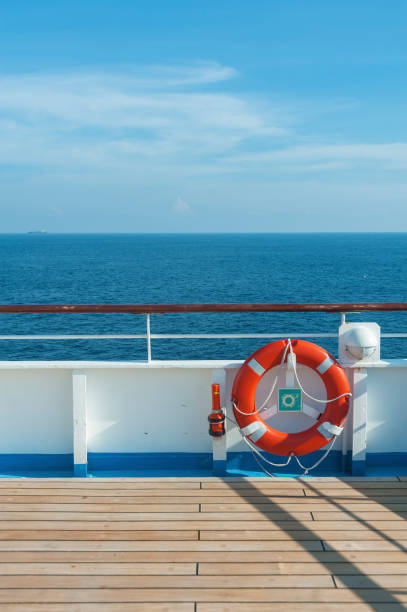 istock Ship deck, buoy and blue ocean. Travel background 1613463416