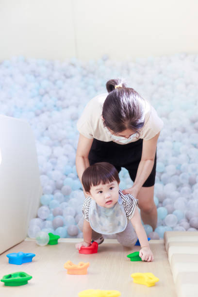 istock Mother is holding her son 1613480922