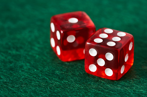 concept of gamble casino red dice on green background. gamble casino red dice on green background. close up gamble casino red dice on green background