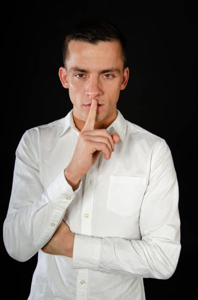 istock Young attractive businessman posing in the studio. 1613499264