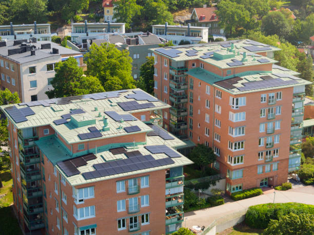 istock Apartment buildings with solar panels on the roof 1613515161