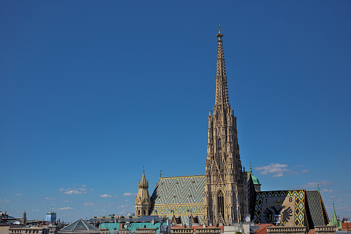Vienna, Austria - June 29, 2023: View of St. Stephens Cathedral in Vienna with stone carvings. A very popular place among tourists. Streets and architecture of the old city.