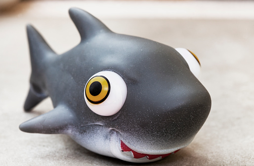 toy shark with selective focus on mottled gray
