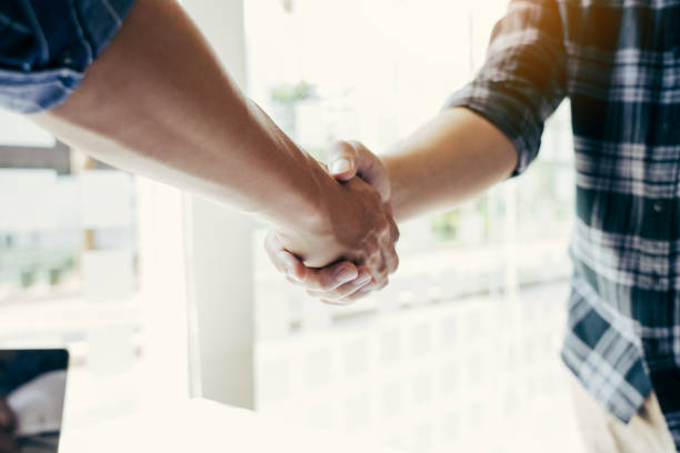 istock Two engineering man with construction worker greeting a foreman at renovating apartment. 1613572519