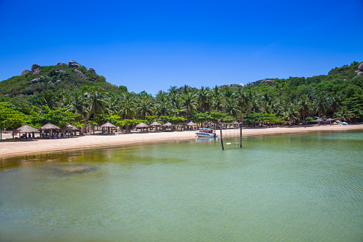 Vietnam, Asia- August 20,2023:The beach from the Small bungalow resort Ngoc Suong, in Cam Ranh Bay,south china sea, Nha Trang, Vietnam, Asia