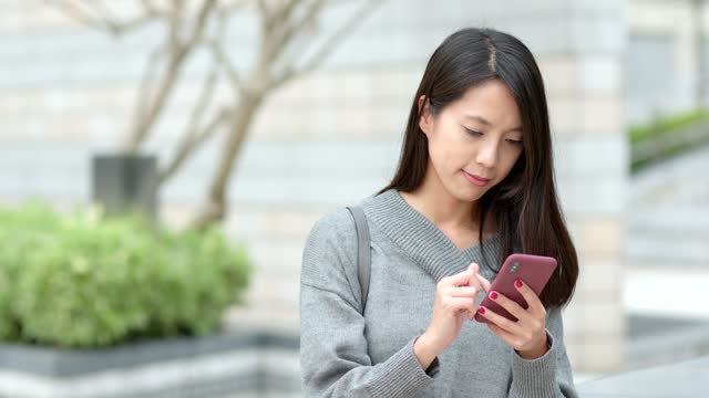 Woman use of smart phone for online
