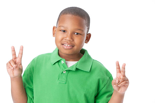 istock Real People: Smiling Little Boy African American Peace Sign 161359740