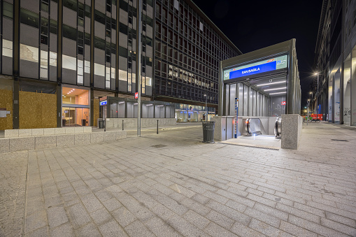 Milan, Italy - August 13, 2023: street view of Milan at night, the new subway station of Milano Linea 4 M4 linea blu is visible.