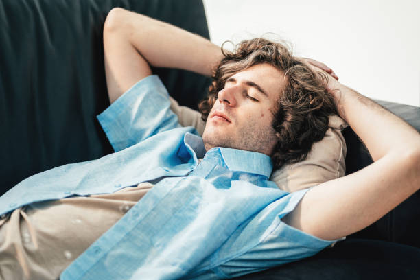 istock Young man taking a nap after a party 1613624691
