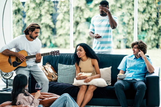 istock Young group of diverse friends talking while waiting party 1613628442