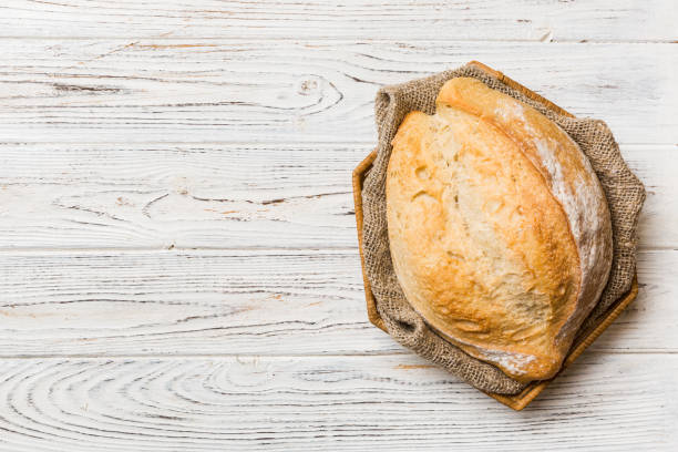 Freshly baked bread on basket against natural background. top view bread copy space