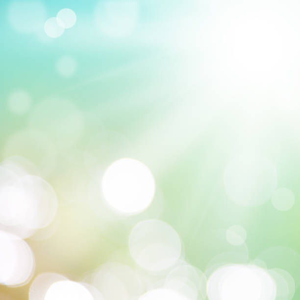 istock Abstract summer background with sun beams and bokeh 1613632922