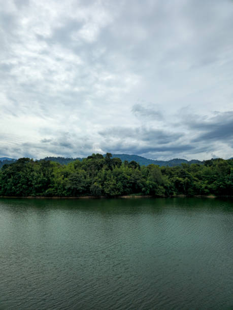 istock Mountain river in river valley. Summer river bank with blue sky and white clouds. River landscape in Kuala Kubu Baru, Selangor, Malaysia 1613637819