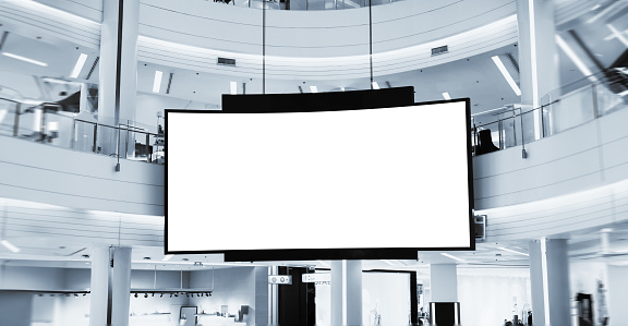 Indoor shopping mall advertising billboard. large video promotion LED screen in public space area