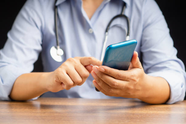 istock A doctor's using a smartphone while sitting in the hospital 1613647709