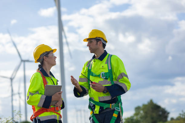 istock Wind turbines technician service teamwork talking together. Engineer team consulting team planing maintenance with lead project supervisor 1613647736