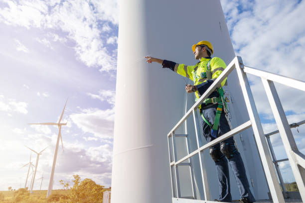 istock Wind turbine technician checking service. Engineer team professional working maintenance clean power generator system 1613648843
