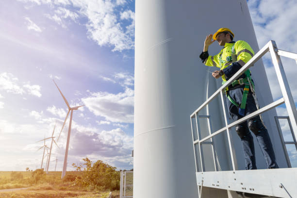 istock Wind turbine technician checking service. Engineer team professional working maintenance clean power generator system 1613648846