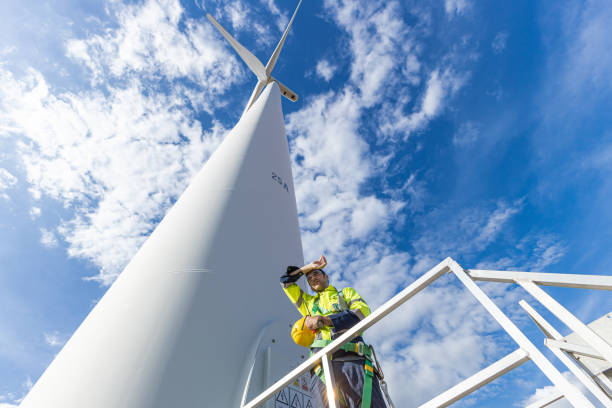 istock Wind turbine technician checking service. Engineer team professional working maintenance clean power generator system 1613648853