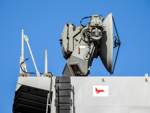 Satellite dish installation on INS Kolkata (D63), a guided missile destroyer of the Indian Navy docked at Garden Island naval base in Sydney Harbour.  This image was taken on a sunny afternoon on 12 August 2023.