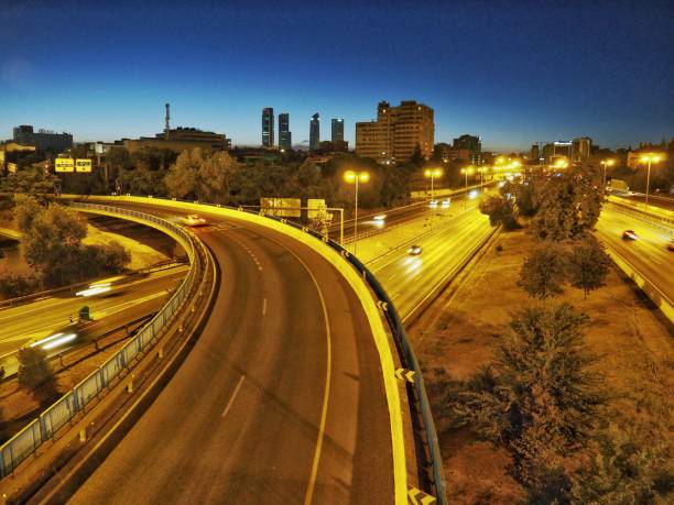 istock Road junction in Madrid at night 1613653600