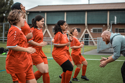 Small multiracial group of females during a soccer training session of a woman's football team
