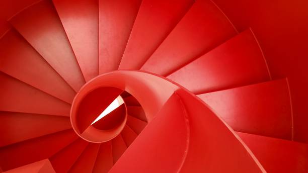 istock Top-down view of a stunning spiral red staircase 1613687035