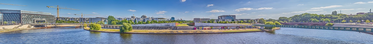 Panoramic picture over the river Spree in Berlin with government district during daytime