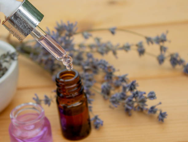 istock lavender essential oil, on a wooden background. Selective focus. 1613698528