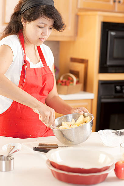 istock Baking: Mixed Race Young Adult Woman Making Apple Pie Kitchen 161370868