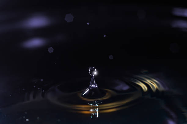 istock A water droplet falling into a tranquil body of water, creating ripples and splashes 1613711983