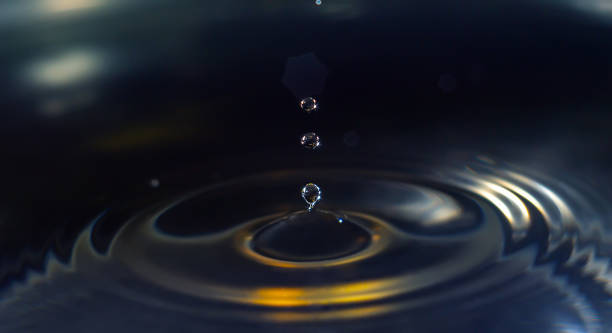 istock A water droplet falling into a tranquil body of water, creating ripples and splashes 1613711984