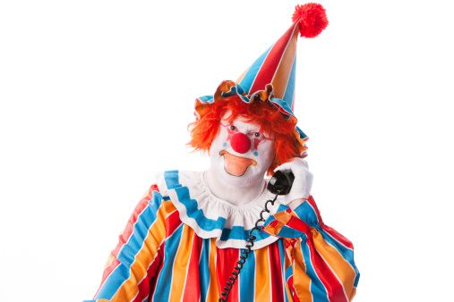 Medium shot. Front view. Cunning clown is up to something Having a plan on gradient background. Professional shot in 4K resolution. 061. You can use it e.g. in your medical, commercial video, business, presentation, broadcast