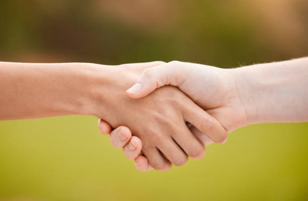istock Support, handshake and teamwork, sports or collaboration for team building, solidarity or unity. People shaking hands, workout partnership or welcome, thank you or greeting for exercise goal outdoors 1613730116