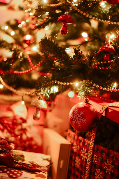 istock Beautiful Christmas gift boxes and presents under the Christmas tree 1613730703