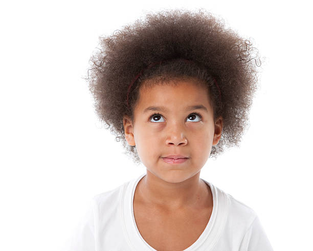 African American Little Girl Looks Up in Contemplation Closeup Headshot An ethnic (African American) little girl has an expression of contemplation or frustration as she looks up with her eyes. rolling eyes irritation displeased facial expression stock pictures, royalty-free photos & images