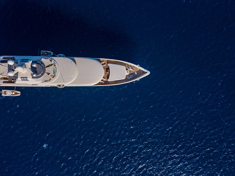 Aerial view on white yacht in blue sea