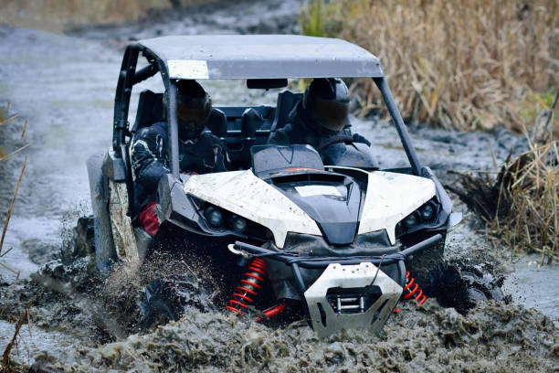 istock Offroad extreme vehicle racing with mud splash. ATV, buggy, quad, UTV, 4x4 1613760669
