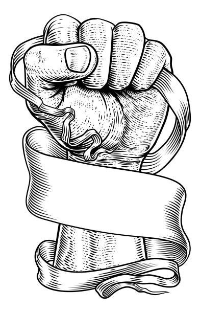 Fist Scroll Paper Banner Ribbon Revolution Concept A fist holding a scroll banner paper ribbon revolution concept in a woodcut engraved etching vintage style. free tatto designs stock illustrations