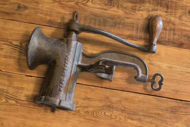 istock Vintage hand meat chopper on the rustic table 1613781143