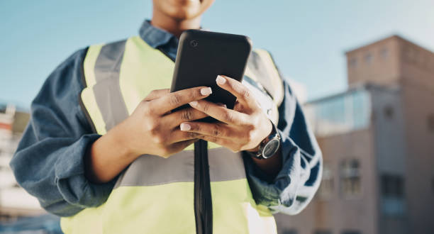 istock Phone, construction worker hands and person typing, networking or search info about inspection, maintenance or building. Cellphone communication, closeup builder or engineer research architecture 1613790693