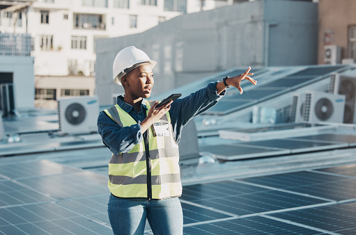 Black woman point, solar panel and speaker phone call for photovoltaic plate, renewable energy grid or project voice note. Rooftop view, cellphone and female engineer talk about construction building