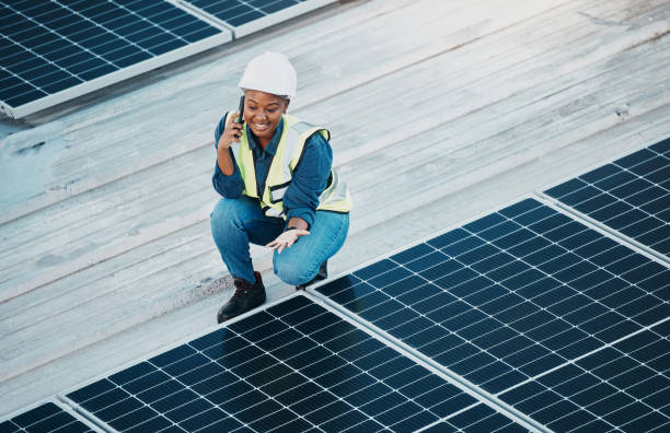 istock Rooftop phone call, solar panel and happy woman communication about renewable energy saving. Sustainable electrical grid, cellphone discussion and female engineer inspection of photovoltaic power 1613790710