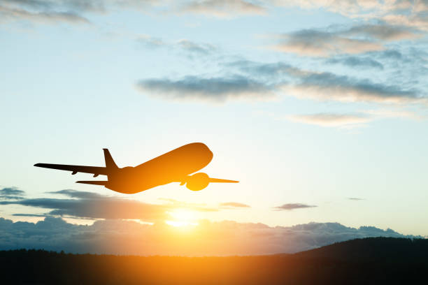 istock Airplane taking off at the sunset sky. 1613794954