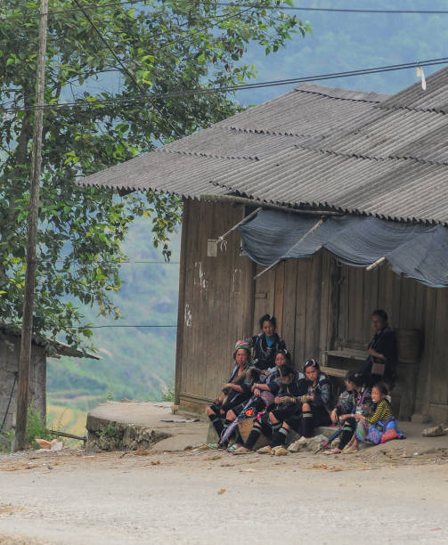 Sapa, Vietnam - Sep 21, 2013. Hmong people sitting at rural house in Sapa, Northern Vietnam. Sa Pa is a town in northwest Vietnam not far from the Chinese border.