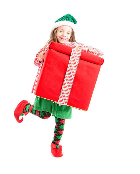 istock Young Christmas Elf Dances with Big Present 161379841