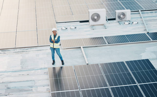 istock Solar panel, construction worker and woman portrait with smile for engineering and building job. Arms crossed, happy and green energy builder and labor employee on industrial site for eco project 1613798946