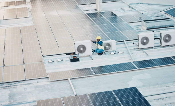 istock Technician, roof and solar panel for clean power, sustainability and maintenance for renewable energy. Engineer, photovoltaic technology and inspection on rooftop, building or electricity development 1613798986