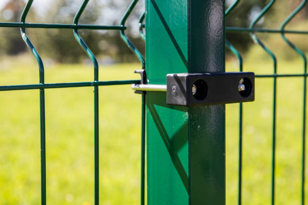 istock Panel fence. Green pole, construction and landscaping 1613801404