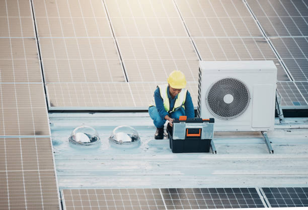 istock Air conditioner, roof and technician man tools, maintenance and solar panel, electrical power generator or energy saving. Electrician person or contractor for ac repair, electricity check or services 1613809148